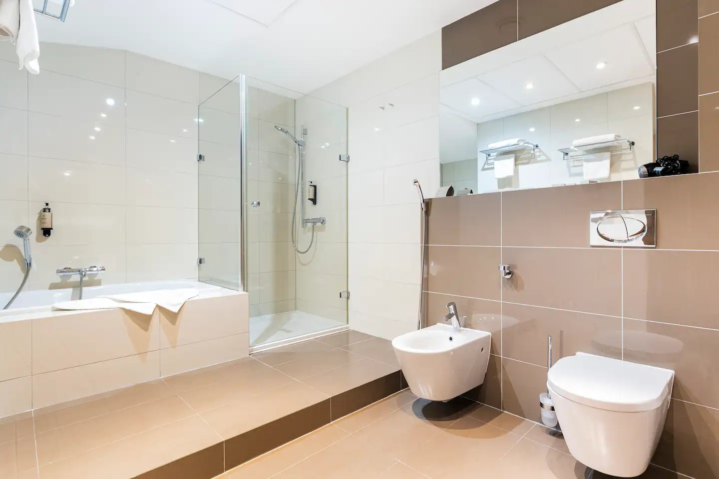 Tulip Residence bathroom with bathtub, walk-in shower and bidet
