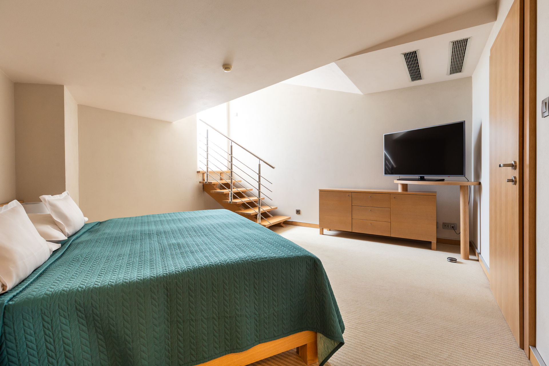 Maisonette downstairs bedroom with king bed, LED TV and internal staircase